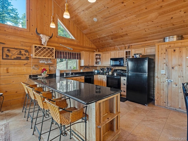 451 Harris Dr, Idaho Springs, CO 80452 - kitchen featuring black appliances, a sink, high vaulted ceiling, wooden walls, and a peninsula