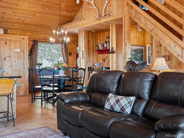 451 Harris Dr, Idaho Springs, CO 80452 - living room featuring vaulted ceiling, a chandelier, wooden walls, light tile patterned floors, and wooden ceiling