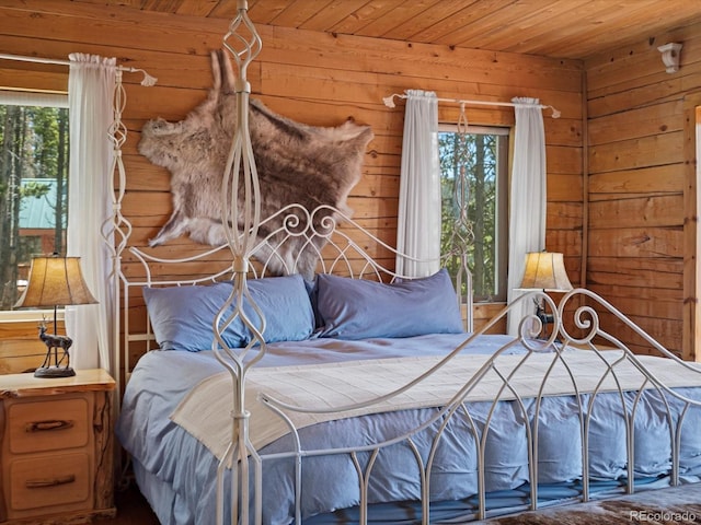 451 Harris Dr, Idaho Springs, CO 80452 - bedroom featuring wood ceiling and wood walls