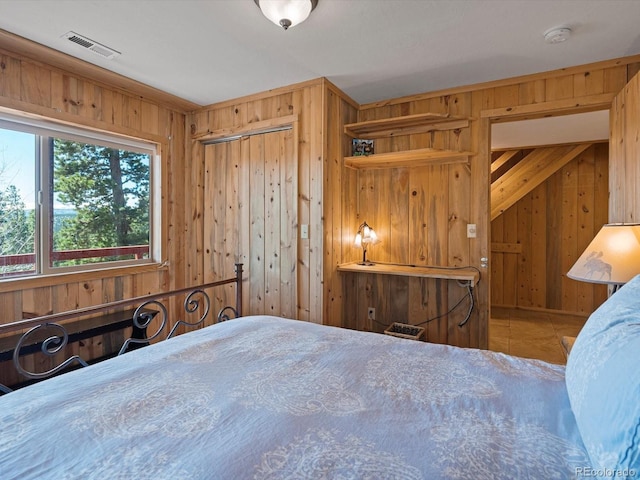 451 Harris Dr, Idaho Springs, CO 80452 - tiled bedroom with wooden walls