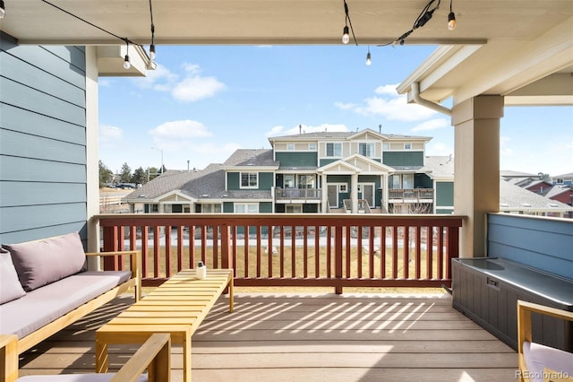 deck featuring a residential view and outdoor lounge area