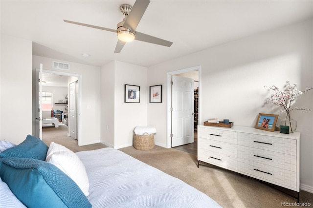 bedroom with visible vents, baseboards, carpet, and a ceiling fan