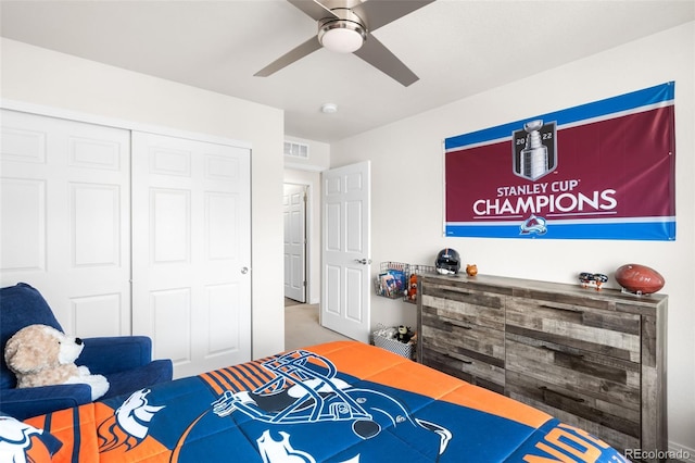 bedroom featuring a closet, visible vents, carpet, and a ceiling fan