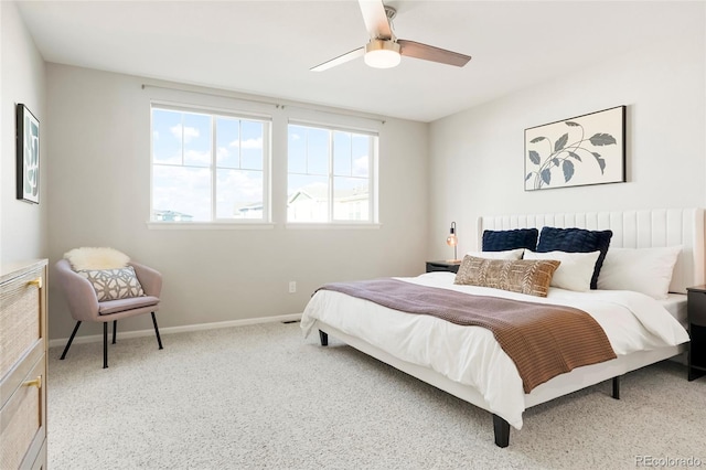 bedroom with ceiling fan and light colored carpet