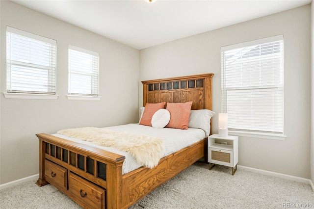 bedroom featuring light colored carpet