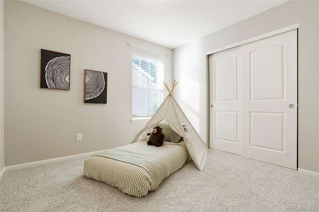 bedroom with a closet and carpet