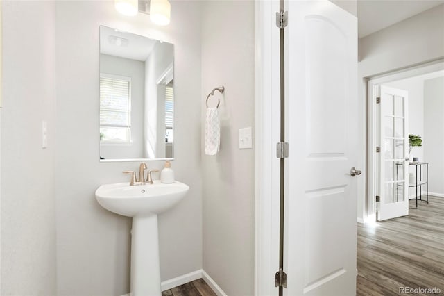 bathroom with hardwood / wood-style floors and sink