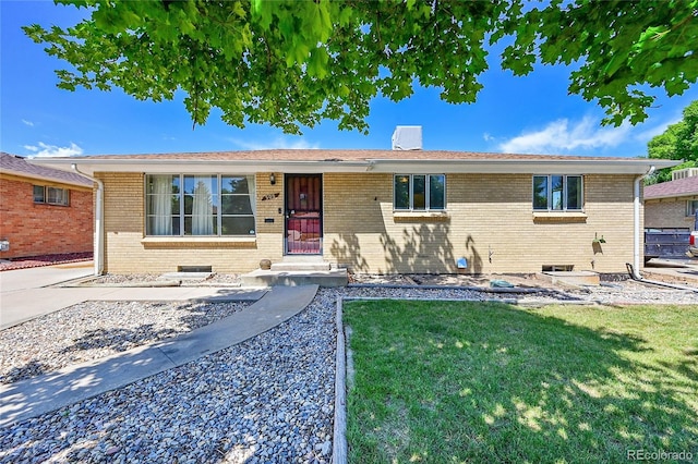 505 Empire St, Aurora, CO 80010 - ranch-style home featuring brick siding and a front yard