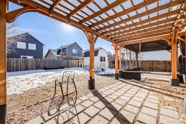 view of patio / terrace featuring a pergola and a storage unit