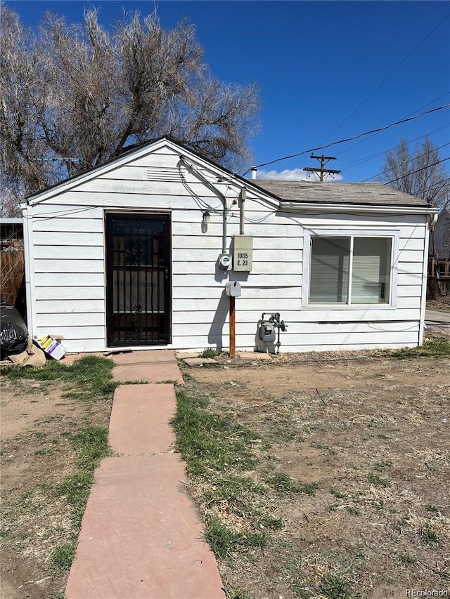 view of front of house with a shed