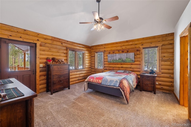 bedroom featuring rustic walls, ceiling fan, high vaulted ceiling, and light carpet