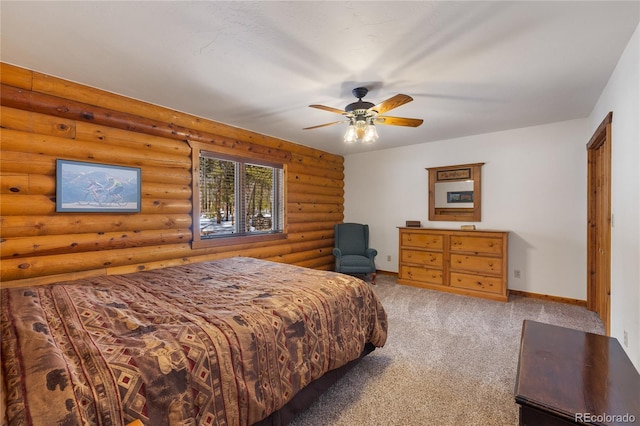 bedroom with ceiling fan, carpet floors, rustic walls, and baseboards