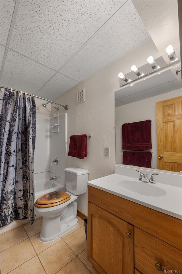 full bathroom with vanity, toilet, visible vents, tile patterned flooring, and shower / bath combination with curtain