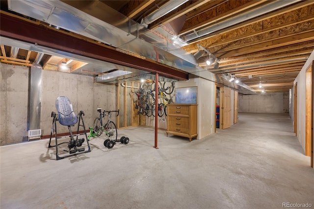 unfinished basement featuring visible vents