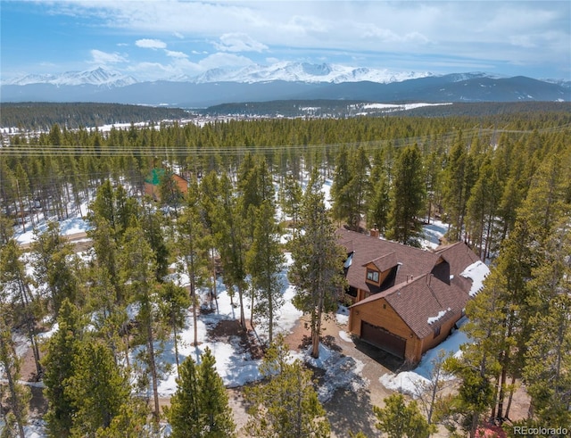 aerial view with a forest view and a mountain view