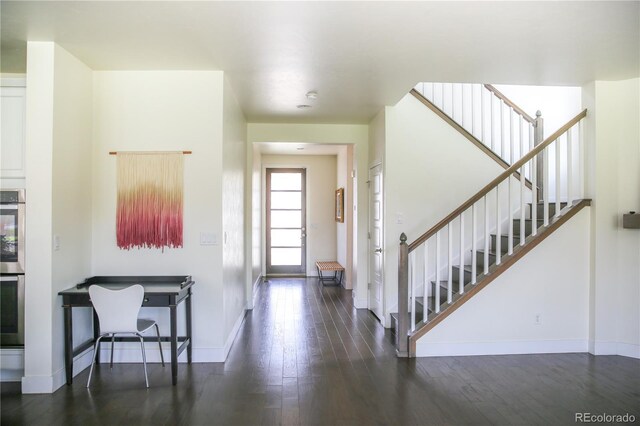 11880 W 38th Pl, Wheat Ridge, CO 80033 - entrance foyer featuring wood finished floors, stairway, and baseboards