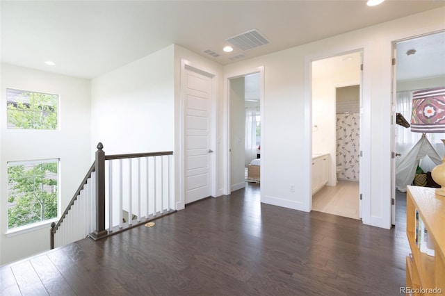 11880 W 38th Pl, Wheat Ridge, CO 80033 - hall featuring plenty of natural light, wood finished floors, recessed lighting, an upstairs landing, and baseboards