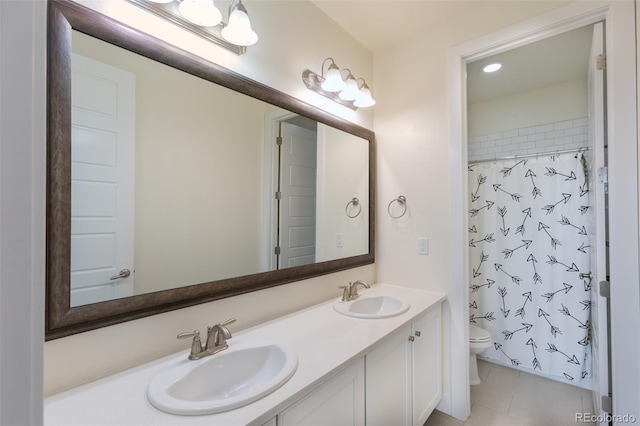 11880 W 38th Pl, Wheat Ridge, CO 80033 - full bath featuring toilet, double vanity, tile patterned flooring, a shower with curtain, and recessed lighting