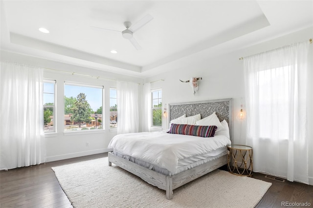 11880 W 38th Pl, Wheat Ridge, CO 80033 - bedroom with a tray ceiling, hardwood / wood-style floors, recessed lighting, baseboards, and ceiling fan
