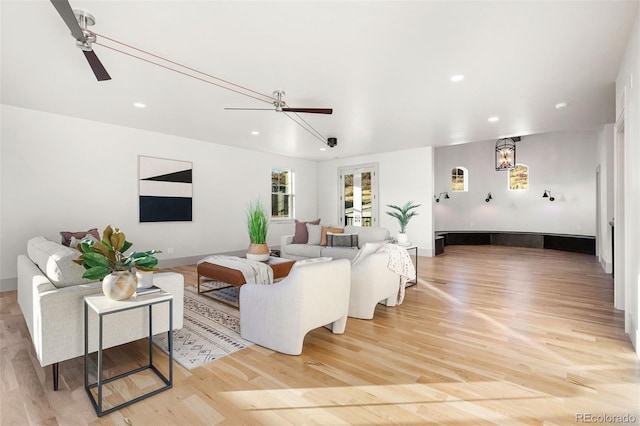 living room featuring recessed lighting, light wood-style floors, and ceiling fan