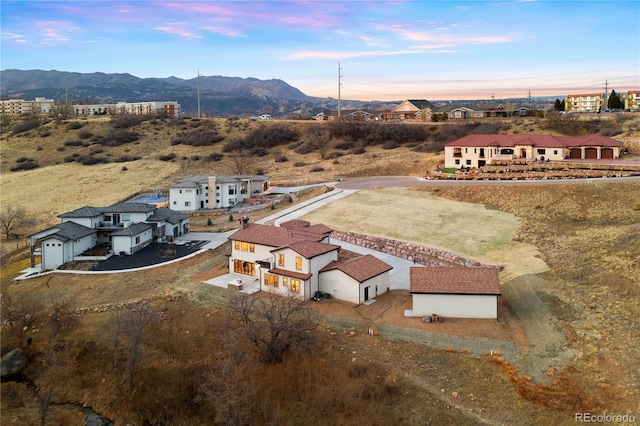 birds eye view of property featuring a mountain view