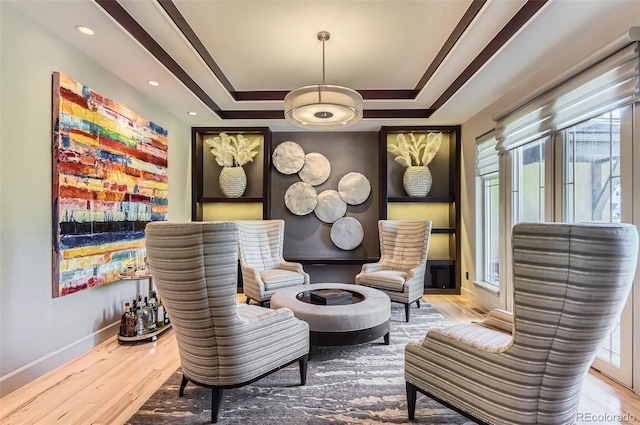 9470 S Silent Hills Dr, Lone Tree, CO 80124 - living area with wood finished floors, baseboards, and a tray ceiling