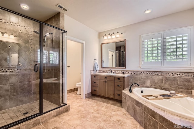 9470 S Silent Hills Dr, Lone Tree, CO 80124 - bathroom with a garden tub, vanity, a shower stall, toilet, and tile patterned flooring