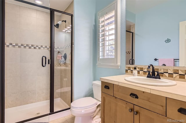 9470 S Silent Hills Dr, Lone Tree, CO 80124 - bathroom featuring toilet, vanity, a stall shower, and tile patterned floors