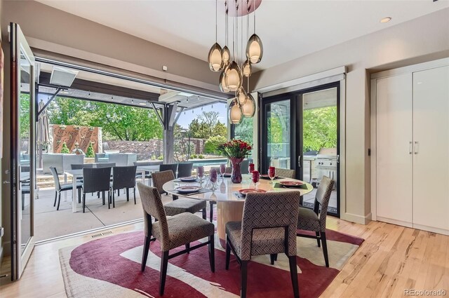 9470 S Silent Hills Dr, Lone Tree, CO 80124 - dining space featuring light wood-style flooring
