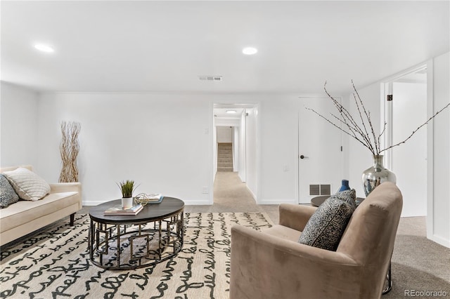 living room with light colored carpet