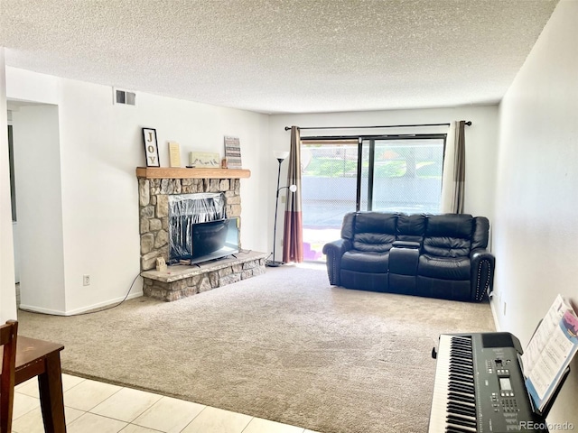 4281 S Salida Way Unit 5, Aurora, CO 80013 - carpeted living room with a textured ceiling, a stone fireplace, and tile patterned flooring