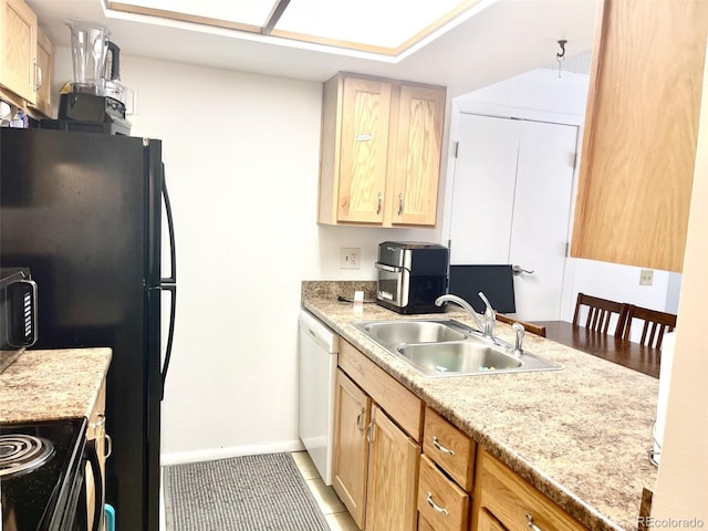 4281 S Salida Way Unit 5, Aurora, CO 80013 - kitchen with a sink, white dishwasher, light countertops, light brown cabinets, and baseboards