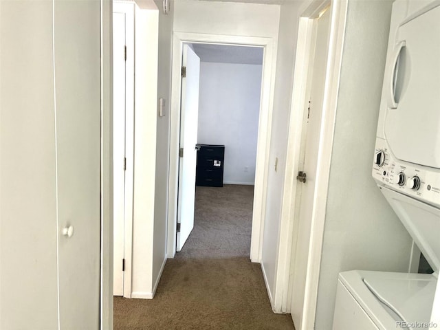 4281 S Salida Way Unit 5, Aurora, CO 80013 - laundry room featuring stacked washer / dryer and carpet floors
