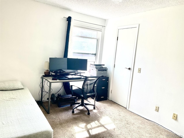4281 S Salida Way Unit 5, Aurora, CO 80013 - bedroom featuring a textured ceiling, carpet flooring, and a desk