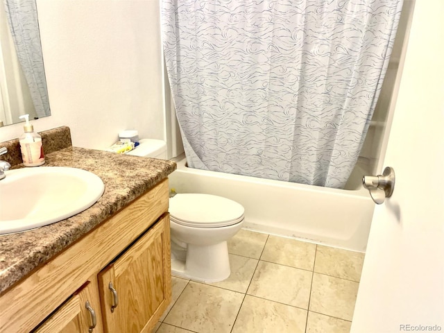 4281 S Salida Way Unit 5, Aurora, CO 80013 - bathroom featuring vanity, shower / tub combo with curtain, toilet, and tile patterned flooring