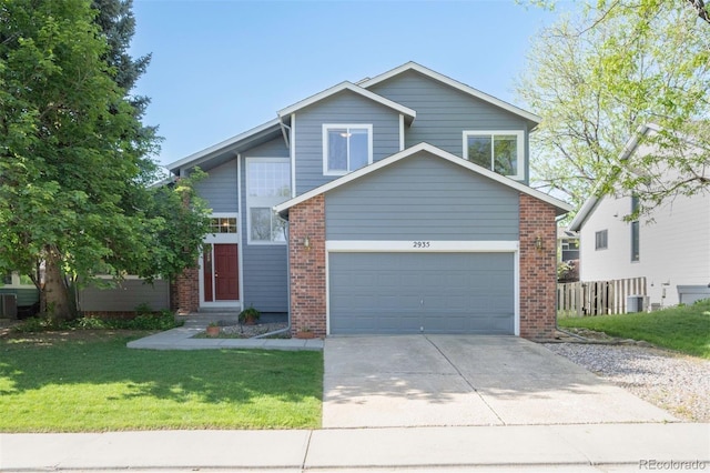 2935 Bow Line Pl, Longmont, CO 80503 - view of front facade featuring concrete driveway, brick siding, a front lawn, central AC unit, and a garage