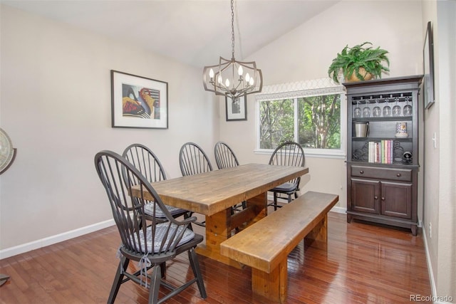 2935 Bow Line Pl, Longmont, CO 80503 - dining room with lofted ceiling, a chandelier, wood finished floors, and baseboards