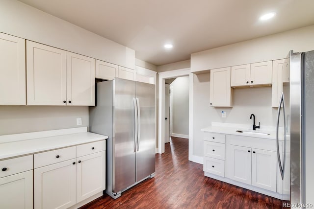 1602 11th Ave, Greeley, CO 80631 - kitchen with freestanding refrigerator, white cabinets, light countertops, and recessed lighting