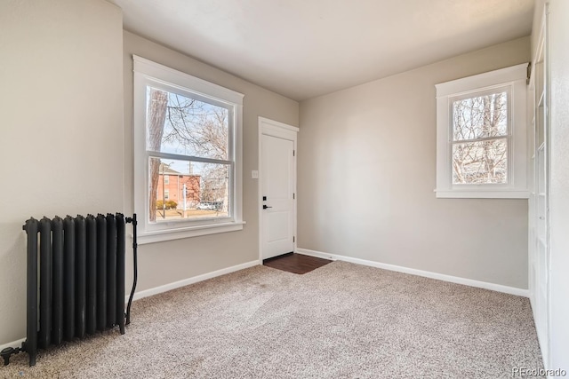 1602 11th Ave, Greeley, CO 80631 - carpeted entryway with radiator heating unit and plenty of natural light