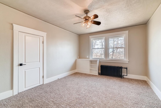 1602 11th Ave, Greeley, CO 80631 - empty room with radiator, light carpet, and ceiling fan