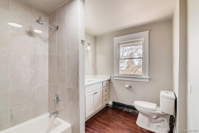 1602 11th Ave, Greeley, CO 80631 - bathroom with vanity, shower / tub combination, and wood finished floors