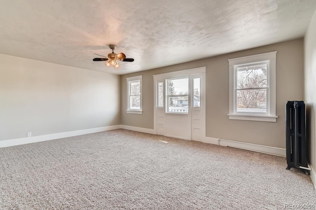 1602 11th Ave, Greeley, CO 80631 - foyer entrance featuring light carpet and ceiling fan