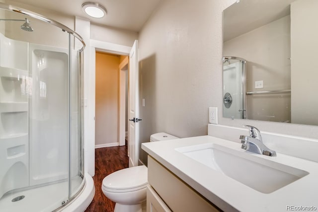 1602 11th Ave, Greeley, CO 80631 - full bathroom featuring a shower stall, wood finished floors, and vanity