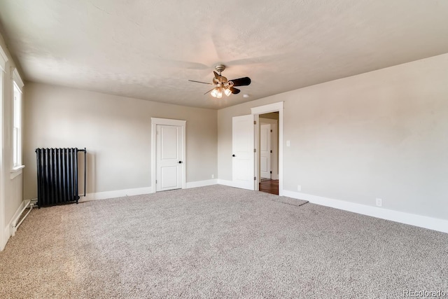1602 11th Ave, Greeley, CO 80631 - unfurnished room with radiator, a ceiling fan, and carpet