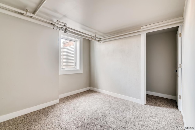 1602 11th Ave, Greeley, CO 80631 - unfurnished bedroom featuring carpet flooring
