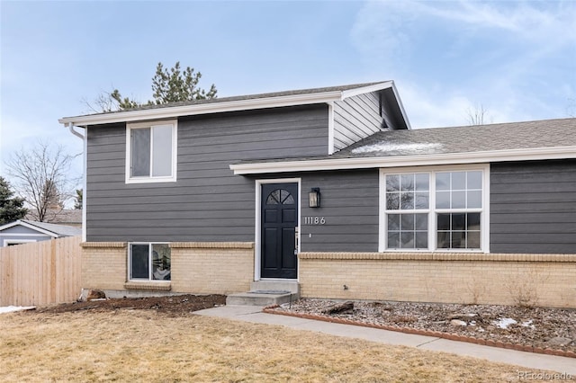 split level home with a front yard