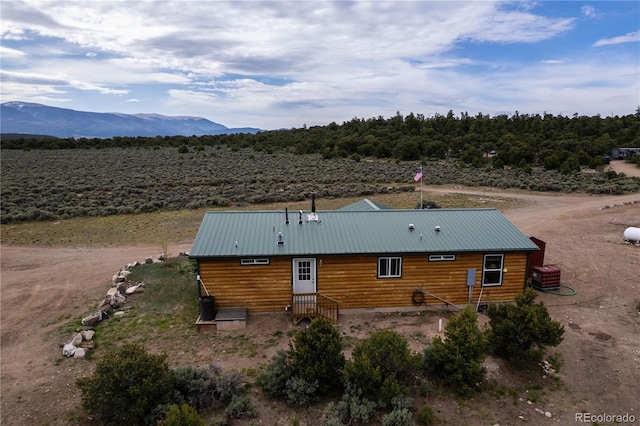 3130 Elk Park Rd, San Luis, CO 81152 - rear view of house featuring a mountain view, central air condition unit, and metal roof