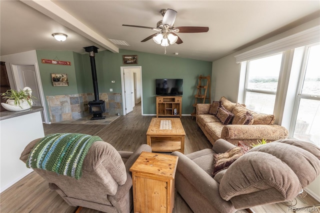 3130 Elk Park Rd, San Luis, CO 81152 - living room featuring plenty of natural light, a wood stove, wood finished floors, and ceiling fan