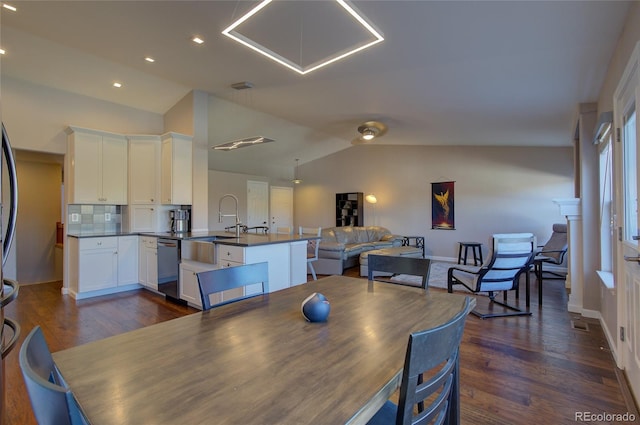 dining area featuring lofted ceiling, recessed lighting, dark wood-type flooring, visible vents, and baseboards