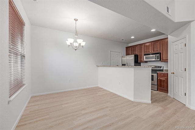 7777 E 23rd Ave Unit 1406, Denver, CO 80238 - kitchen with appliances with stainless steel finishes, light wood-style floors, a chandelier, baseboards, and hanging light fixtures